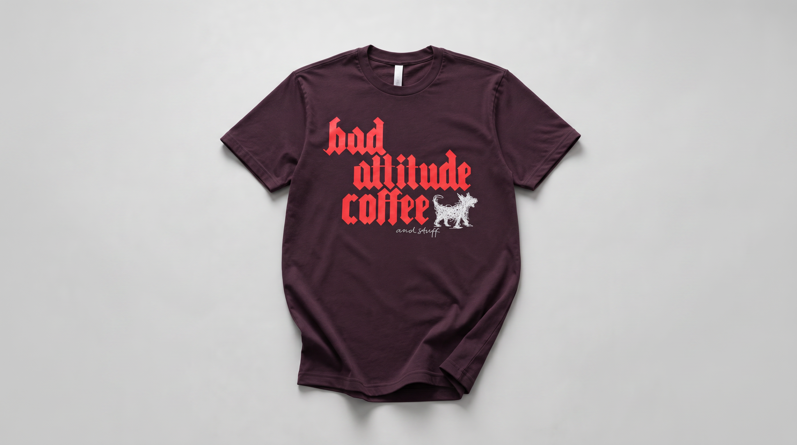 A dark maroon short-sleeve t-shirt with a graphic print reading 'bad altitude coffee' in red gothic font, accompanied by a white dog illustration and the brand name 'animal party' in white script. The shirt is laid flat on a light gray background.